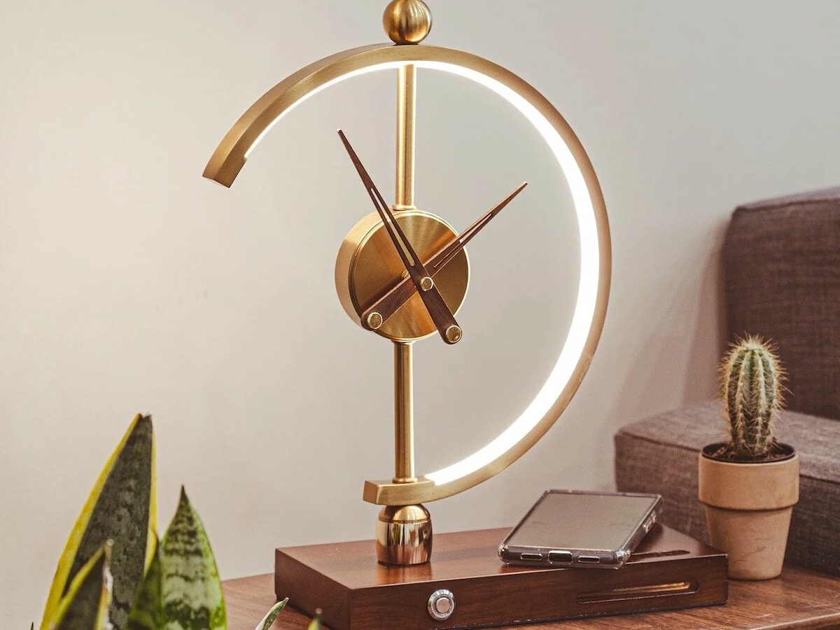 Khonsu Clock Lamp has a wireless-charging design that keeps your everyday devices charged