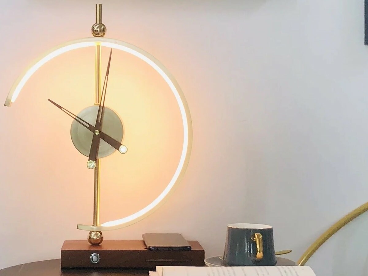 Khonsu Clock Lamp has a wireless-charging design that keeps your everyday devices charged