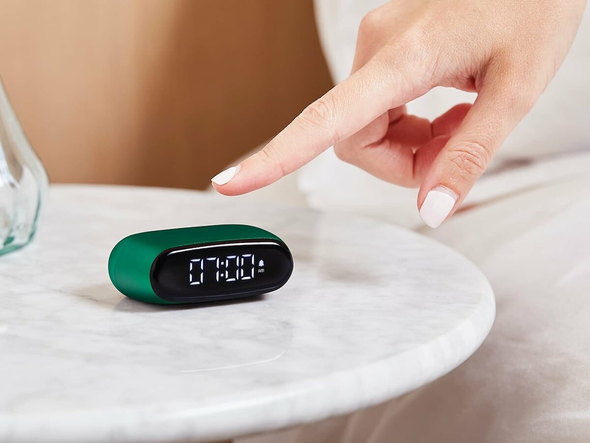 Lexon Minut palm-size-design alarm clock is elegant and fits in any bag for travel