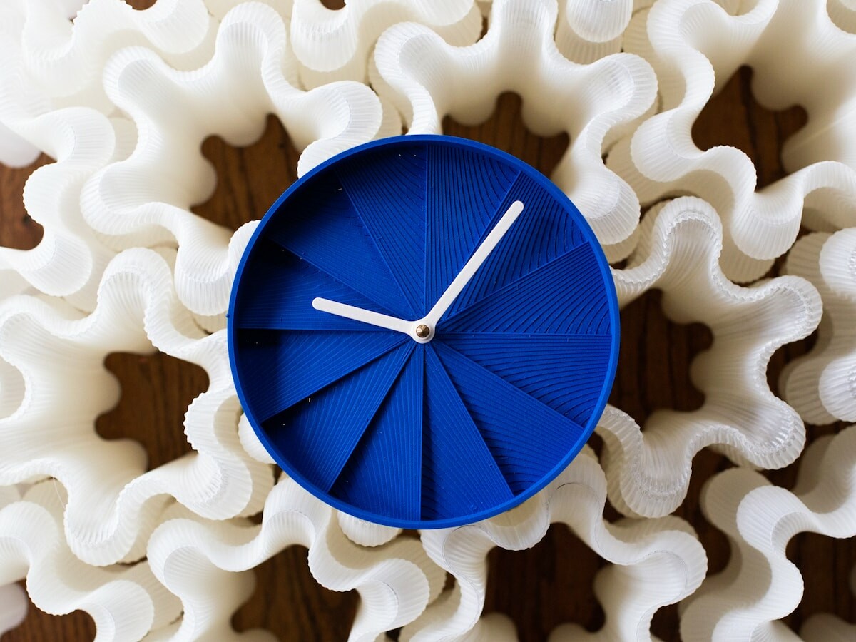 Wooj Design Masuno Clock zen wall clock incorporates asymmetry, harmony, & tranquility